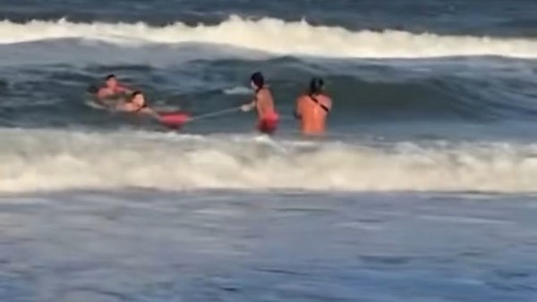 Volusia County lifeguards help swimmer in need