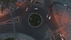 Cars driving around an intersection - Free Stock Video