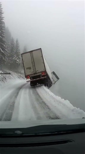 Semi Truck Slides Off Icy Mountain Road and Vanishes into Fog 🚛