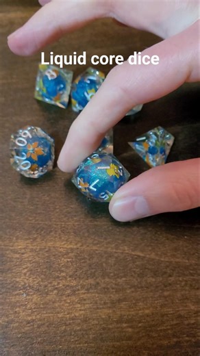 Liquid core dice #dice #dicegoblin #dnd #dnddice #mezmerizing #glitter #d20 #mystical