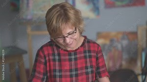 Drawing watercolor. Drawing Technique. Selection of facial features. Artist applies facial expressions to a painted female head. Live image. Drawing lessons