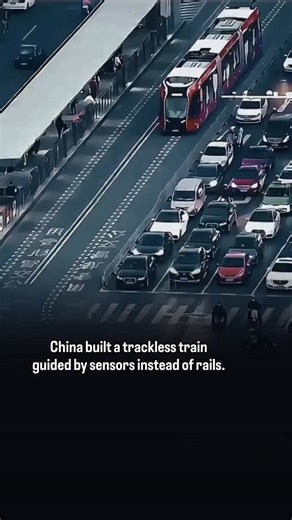 tryyalone on Instagram: "This video shows China's Autonomous Rail Rapid Transit system, a trackless train that follows virtual rails painted on city roads instead of steel tracks. Using optical and LiDAR sensors, the vehicle reads guidance markings in real time and adjusts steering acceleration, and braking automatically. The result is tram-like precision without the cost and rigidity of traditional rail infrastructure. Because it runs on rubber tires and electric power, the system is faster to 