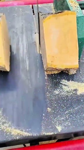 Bandsaw slicing freshly cut log into usable lumber