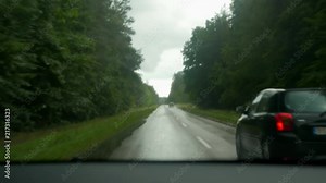 driving a car, downpour, heavy rain, driver's and passenger's perspective, overtaking
