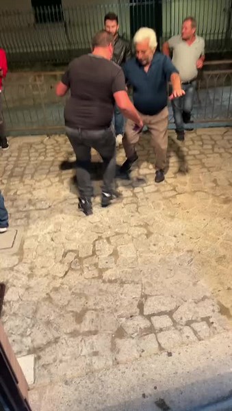 Outdoor Physical Altercation Among Men at Night