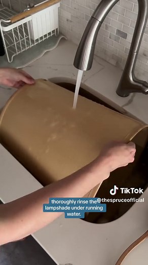 Welcome new life to a thrifted yellowed lampshade! Here, Candace shows how she cleaned and removed stains, dirt, and dust to reveal a new-looking lampshade. Tap the link for your go-to guide to thrifting packed full of expert thrifting advice, foolproof methods to remove any mystery stain, and much more. #TheSpruce #cleaning #thrifted #thrifting #home #lamp #design #style #cleaning #clean #tipsandtricks #hack #styling