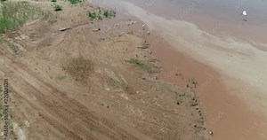 Aerial video of the Red River which borders between Texas and Oklahoma. This was shot just west of where highway 35 crosses the river into Oklahoma. Great Egrets or White Herons on the shore.