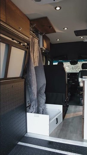 Camper Van Shower System Stows in a Cabinet