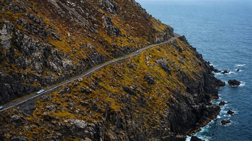 The narrow road carved into a giant ocean cliff