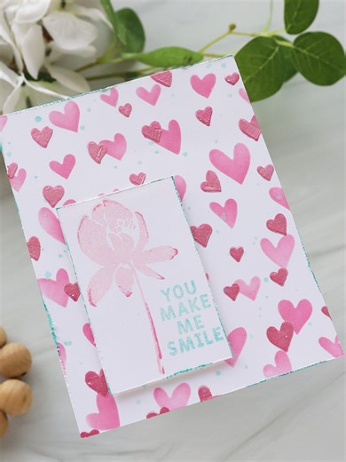 Pink hearts subtle shine = instant happy 💕✨ This sweet card by @createitwithjoy features Ranger Metallic Texture Paste tinted with @tim_holtz Distress Oxide Picked Raspberry Reinker—because when your paste gets dressed up, magic happens. Soft shimmer, playful texture, and a message that says it all: you make me smile. Would you keep this color combo soft and sweet… or go bold next time? 👀🎨 Supplies: Ranger: -Metallic White Texture Paste -Artist Brushes -Mini Ink Blending Tool with Foam Tim Ho