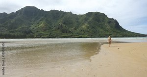 Beautiful Woman on Breathtaking Pristine Beach on Island of Oahu, Hawaii
