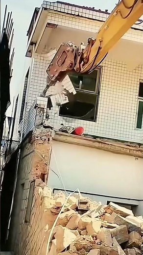 the process of demolishing a building using an excavator to speed up the demolition #automobile