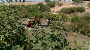 This video from our media partner KINT shows migrants crossing a canal in El Paso on Tuesday. The bodies of a man and girl were found in a canal in the Lower Valley. It is unclear of any migrants in the video are the victims. STORY: http://bit.ly/2WAOIbH (Video credit: KINT) | KFOX-TV