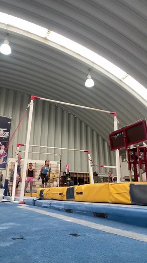 Gymnastics Training Session on Uneven Bars