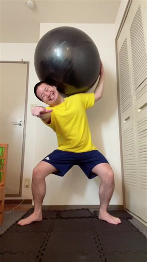 Indoor Workout with Large Black Exercise Ball
