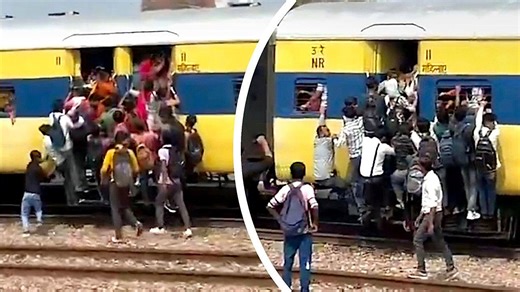 Dangerous overcrowding: Passengers cling to doors on packed Indian railway