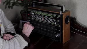 Very Old Woman Hand Changing Stations On A Very Old Radio, Pan