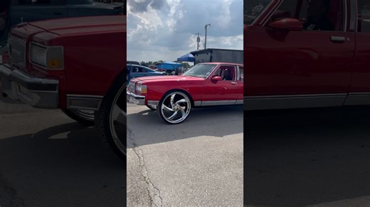 Red box Chevy on 28” billets riding
