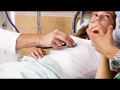 Doctor Listening To Teen's Heartbeat Stock Video