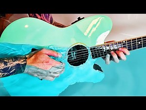 Playing guitar underwater actually sounds HEAVENLY