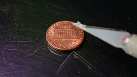 clip-3972726135-fentanyl-two-milligrams-on-one-cent-coin