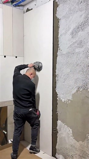 large porcelain wall panel installation activity using suction tools for a seamless finish