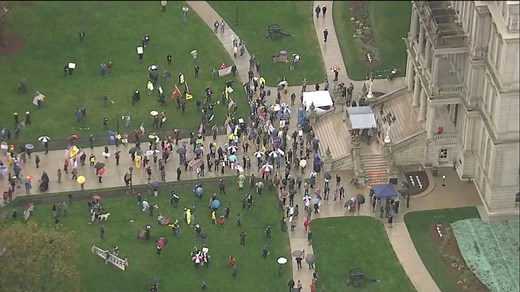 Protesters storm Michigan Capitol building