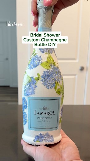 Looking for a fun bridal shower idea? 🤍👰‍♀️ Gift the bride-to-be a DIY custom champagne bottle. 🍾 #DIY #customchampagnebottle #DIYchampagnebottle #bridalshowerideas #bridalshower #bridalshowergift | PureWow