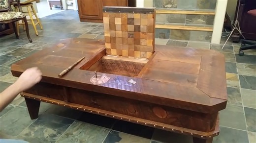 Magic coffee table has hidden compartments.