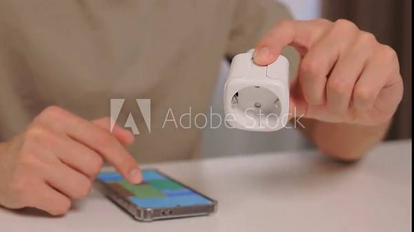 Smart device setup, User demonstrates smart socket connection, Closeup of smart plug pairing process, Installation and control of European style smart socket device