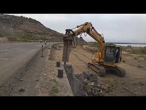 Demolishing a old box culvert by using Breaker