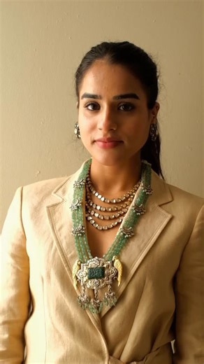 Apala by Sumit on Instagram: "✨ Introducing the Majestic Elegance Collection ✨ The necklace features a pair of finely sculpted parrots poised gracefully on either side of a Mughal-inspired pendant, centering a beautifully carved green corundum that anchors the composition. The necklace is strung with fine green aventurine beads, punctuated by crescent motifs delicately embellished with freshwater pearls, adding rhythm and refinement to the design. Multiple strands of organically shaped quartz po