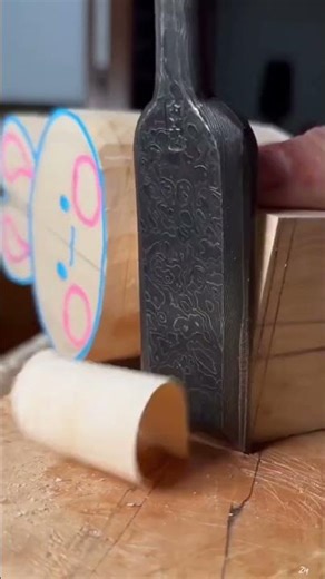 the process of carving wood to form dolls