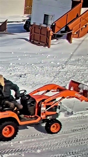 Kubota BX snow clearing with blower