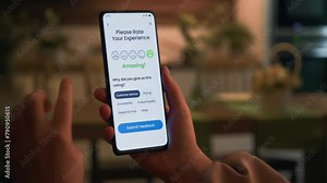 Leaving positive customer feedback via an application on a smartphone. Good customer experience and nice performance. Customer satisfaction concept.