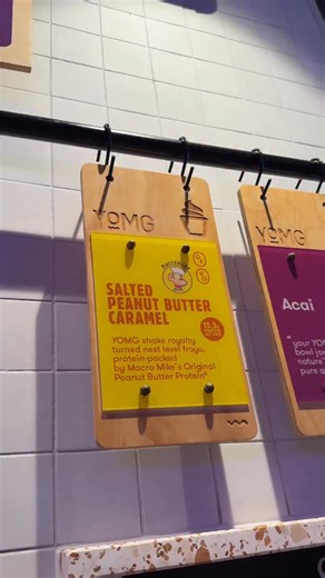 Make the perfect high-protein (vegan-friendly) frozen yogurt — using our #YOMGlimited Macro Mike @macr0mike SALTED PEANUT BUTTER CARAMEL 🤌🏻 swirling only for a limited-time @yomgburgers | YOMG