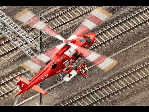 Look down on rescue helicopter hoist training Rega Leonardo AW109 Da Vinci in action