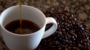Download Slowly pouring coffee  for free