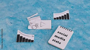 creative content and social media success, photo and video digital content icon with stats going both up and down