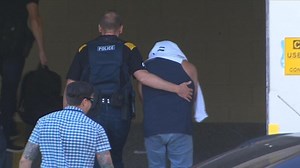 Accused bank robber faces court