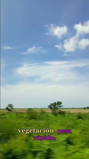 Radiant nature, green meadows, trees, blue sky, hills in the distance, and beautiful clouds