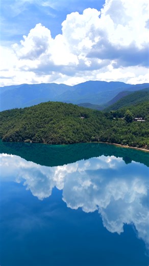 Summer at Lugu Lake | A Mirror of Mountains and Sky It’s the most beautiful season at Lugu Lake in Ninglang, Yunnan. Under the sun, the lake becomes a giant mirror — reflecting blue skies, white clouds, and emerald hills. 📍Come see Lugu Lake at its summer best! #LuguLake #SummerInYunnan #MirrorLake #Ecotourism #naturephotography #Lijiang #HiddenParadise | Amazing Yunnan