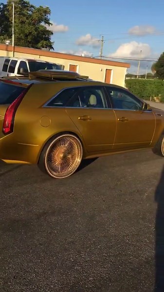 Candy gold CTS wagon on gold 24” Daytons w/Vogue tires