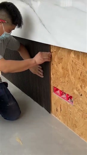 the process of installing thin striped boards on the walls in the family room for decoration #shorts