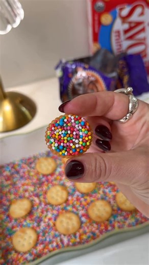 Carly Smith | Dietitian on Instagram: "✨ 3-Ingredient Freckle Biscuits ✨ These mini freckle biscuits are such an easy and fun activity to do with the kids and they actually taste amazing. You only need: 🍪 Mini Savoy/Jatz biscuits 🍫 Chocolate melt buttons 🌈 Sprinkles Pour the sprinkles into a baking dish and spread the chocolate melts evenly over the top. Pop the dish into the oven for a couple of minutes, just until the chocolate starts to soften. Remove from the oven, place the biscuits on t