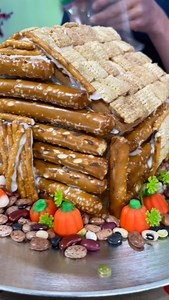 Buy the gingerbread house kit but make it into a Thanksgiving log cabin instead! That’s one idea for Thanksgiving fun and games from Macaroni Kid The full story on AccessCarolina.com @macaronikidgreenville @macaronikid #thanksgivinglogcabin @margaret_burnquist_tv | Access Carolina