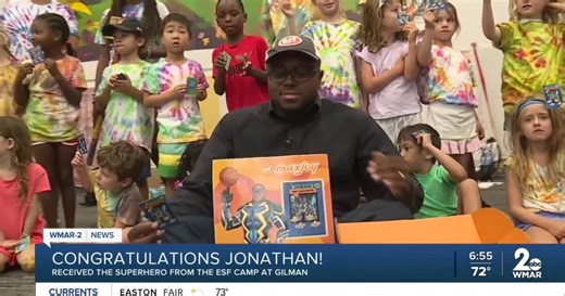 A local summer camp honored WMAR-2 News' Jonathan Hunter with Superhero card