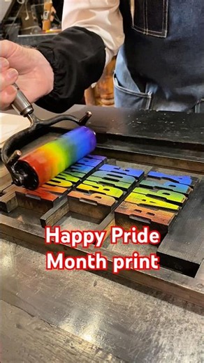 Howard makes a large rainbow letterpress print at the Sacramento History Museum for Pride Month