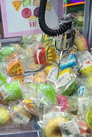 Playing The Toy Grab Machine In The Arcades