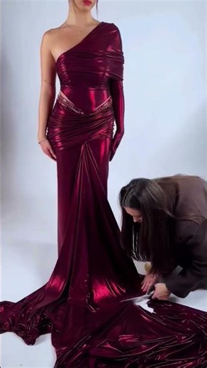 To order this burgundy dress DM reineecouture A striking strapless gown crafted from lustrous
